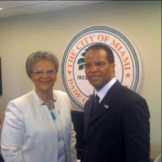 John Hope Bryant meets with Haitian Prime Minister Michele Pierre-Louis, and Miami Mayor Manny Diaz
