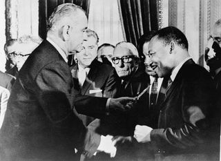 LBJ_and_Dr-_King_after_signing_Civil_Rights_Act_of_1964_t580
