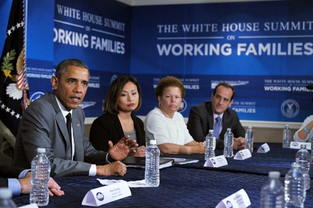 President Barack Obama takes part in a round table discussion during the White House Summit on Working Families on June 23 