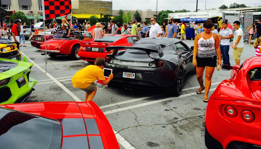 A boy captured in his own moment with the Mansory Lotus Evora GTE