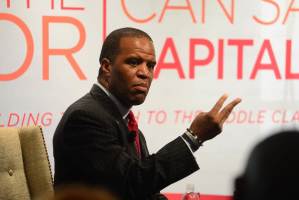 John Hope Bryant speaking to young people on the economy, at the Coca-Cola Company
