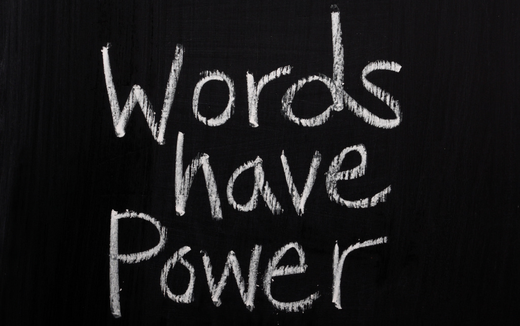 The phrase Words Have Power on a Blackboard